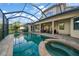 Stunning pool and spa with screened enclosure at 667 Richmond Close, Tarpon Springs, FL 34688