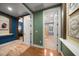 Bright hallway bathroom with double doors and hardwood floors at 667 Richmond Close, Tarpon Springs, FL 34688