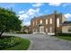 Brick building with a grand entrance, offering curb appeal and architectural details at 667 Richmond Close, Tarpon Springs, FL 34688