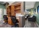 Home office with built-in desk and seating for two at 667 Richmond Close, Tarpon Springs, FL 34688