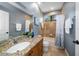 Bathroom with granite countertop, tub and shower at 667 Richmond Close, Tarpon Springs, FL 34688