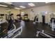 Bright fitness center with modern exercise equipment and mirrored wall at 7979 Sailboat Key S Blvd # 506, South Pasadena, FL 33707