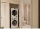 Interior laundry room with stackable washer and dryer units at 7979 Sailboat Key S Blvd # 506, South Pasadena, FL 33707