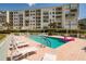 Inviting pool area with plenty of lounge chairs at 7979 Sailboat Key S Blvd # 506, South Pasadena, FL 33707