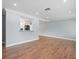 Open living space with kitchen pass-through and hardwood floors at 2347 Eastwood Dr, Clearwater, FL 33765