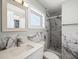 Modern bathroom with marble-look shower and vanity at 2347 Eastwood Dr, Clearwater, FL 33765
