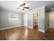 Spacious bedroom with hardwood floors, a ceiling fan and an ensuite bathroom at 2347 Eastwood Dr, Clearwater, FL 33765