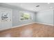 Bright living room with hardwood floors and large window at 2347 Eastwood Dr, Clearwater, FL 33765