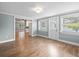 Spacious living area with hardwood floors and view into the kitchen at 2347 Eastwood Dr, Clearwater, FL 33765