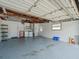 Attached garage with washer, dryer and ample storage shelving at 2347 Eastwood Dr, Clearwater, FL 33765