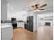 Updated kitchen boasts stainless steel appliances and white cabinets at 2347 Eastwood Dr, Clearwater, FL 33765