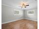 Large bedroom with ceiling fan, hardwood floors and neutral walls at 2347 Eastwood Dr, Clearwater, FL 33765