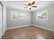 Well-lit bedroom with hardwood floors and ceiling fan at 2347 Eastwood Dr, Clearwater, FL 33765