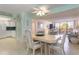 Dining room with table and chairs, open to living room at 1 Key Capri # 102E, Treasure Island, FL 33706