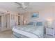 Main bedroom with king bed and white wicker furniture at 1 Key Capri # 102E, Treasure Island, FL 33706
