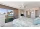 Main bedroom with king-size bed and water view from sliding doors at 1 Key Capri # 102E, Treasure Island, FL 33706