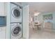 Stackable LG washer and dryer in a convenient laundry closet at 1 Key Capri # 102E, Treasure Island, FL 33706