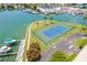 Aerial view of tennis court with marina view at 1 Key Capri # 102E, Treasure Island, FL 33706