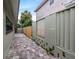 Small paved patio area adjacent to a fence, providing a private outdoor space at 800 Pasadena S Ave, St Petersburg, FL 33707