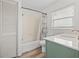 Bathroom features a bathtub, shower, and updated vanity at 800 Pasadena S Ave, St Petersburg, FL 33707