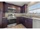 Modern kitchen with stainless steel appliances and granite counters at 800 Pasadena S Ave, St Petersburg, FL 33707