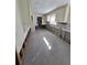 New gray kitchen floor tile, white cabinets, under renovation at 165 97Th Ne Ave, St Petersburg, FL 33702