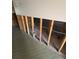Unfinished basement with exposed framing and tile flooring at 165 97Th Ne Ave, St Petersburg, FL 33702