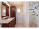 Bathroom features a vanity with granite countertop and walk-in shower at 165 97Th Ne Ave, St Petersburg, FL 33702