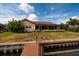 Home's backyard with canal access and dock at 165 97Th Ne Ave, St Petersburg, FL 33702