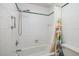 Clean bathroom with shower and floral shower curtain at 165 97Th Ne Ave, St Petersburg, FL 33702