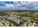 Aerial view of waterfront home with private dock and canal access at 165 97Th Ne Ave, St Petersburg, FL 33702