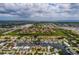 Aerial view of waterfront home with private dock and lush landscaping at 165 97Th Ne Ave, St Petersburg, FL 33702