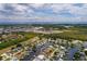 Aerial view of waterfront home with private dock and lush landscaping at 165 97Th Ne Ave, St Petersburg, FL 33702