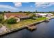 Aerial view showcasing the property's waterfront location and dock at 165 97Th Ne Ave, St Petersburg, FL 33702