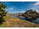 View of the canal and neighboring houses from the backyard at 165 97Th Ne Ave, St Petersburg, FL 33702