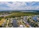 Aerial view of waterfront home with private dock and lush landscaping at 165 97Th Ne Ave, St Petersburg, FL 33702