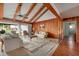 Relaxing living room with wood-paneled walls, vaulted ceilings, and ample natural light at 165 97Th Ne Ave, St Petersburg, FL 33702