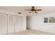 Bright bedroom with large closet and ceiling fan at 165 97Th Ne Ave, St Petersburg, FL 33702