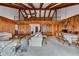 Spacious living room features high ceilings, exposed wooden beams, and a loft area at 165 97Th Ne Ave, St Petersburg, FL 33702