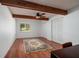 Spacious bedroom with wood flooring, ceiling fan and window with shutters at 165 97Th Ne Ave, St Petersburg, FL 33702
