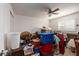 Bedroom with window, ceiling fan, and ample storage space at 165 97Th Ne Ave, St Petersburg, FL 33702