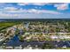 Aerial view of waterfront home with private dock and lush landscaping at 165 97Th Ne Ave, St Petersburg, FL 33702