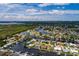 Aerial view of waterfront home with private dock and lush landscaping at 165 97Th Ne Ave, St Petersburg, FL 33702