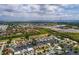 Aerial view of waterfront home with private dock and lush landscaping at 165 97Th Ne Ave, St Petersburg, FL 33702