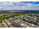 Aerial view of waterfront home with private dock and lush landscaping at 165 97Th Ne Ave, St Petersburg, FL 33702