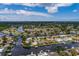 Aerial view of waterfront home with private dock and lush landscaping at 165 97Th Ne Ave, St Petersburg, FL 33702
