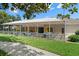 Screened patio with tables and chairs next to pool at 7495 Heather Walk Dr, Weeki Wachee, FL 34613