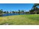 Spacious backyard offering a serene view of the canal at 3627 Ortona Dr, Holiday, FL 34691