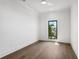 Bright bedroom with hardwood floors, ceiling fan, and a window with an exterior view at 1254 Cordova Ne Blvd, St Petersburg, FL 33704