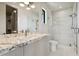 Elegant bathroom with marble countertops, a glass shower, and modern fixtures at 1254 Cordova Ne Blvd, St Petersburg, FL 33704